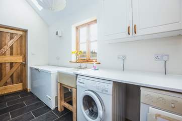 There is a handy utility area with access to the garden, a perfect room for extra storage and of course the essential washing facilities.