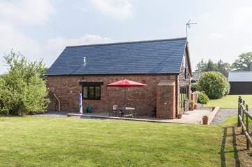 This side of the cottage has a lovely lawned garden and the patio.