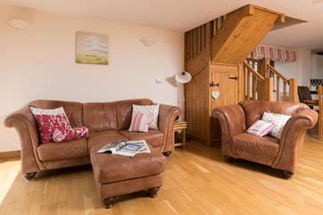 There are two wonderful squishy sofas and a deep armchair too. Plenty of choice for you all.