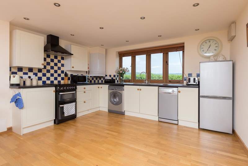 The kitchen is well set out, extremely well-equipped and has unspoilt rural views from the kitchen sink! Not that you have to wash up as of course there is a dishwasher.