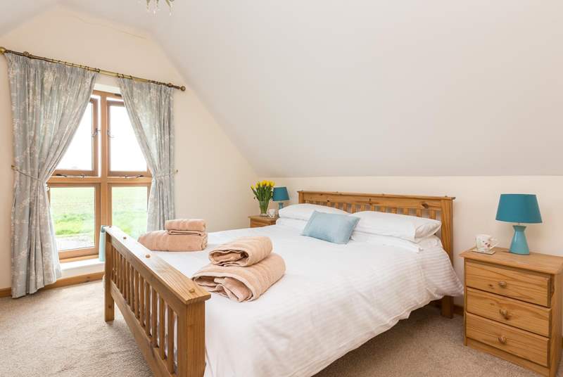 This is the double bedroom with its king-size bed and views across the countryside.