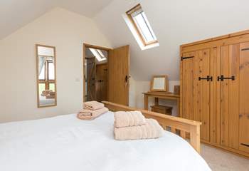 Another view of the double bedroom. There is plenty of storage and additional light from the Velux window.