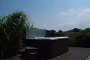 What a setting for the supersize hot tub, in a private garden with countryside views across the fields.