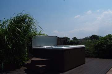 What a setting for the supersize hot tub, in a private garden with countryside views across the fields.