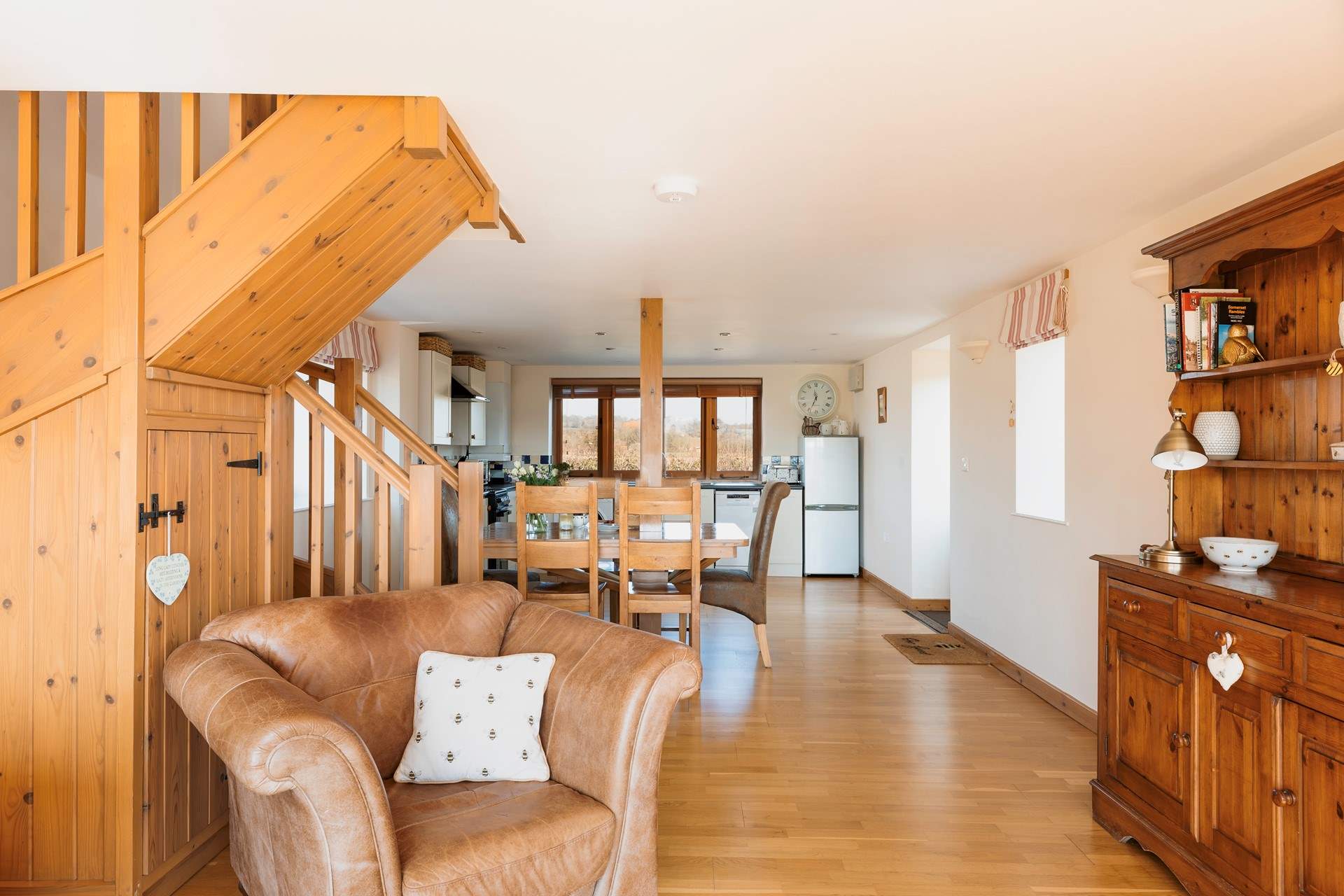 The kitchen is at one end of the room, the dining space in the middle and sitting area to the other end, making a very sociable space.