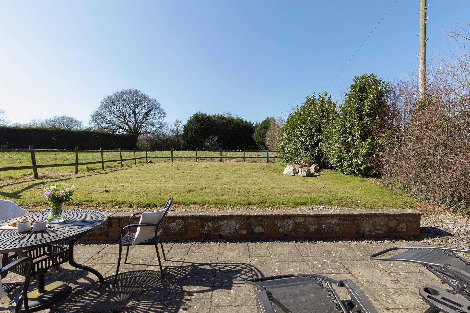 On the other side of Bumble Bee Barn is a lawned area with patio.