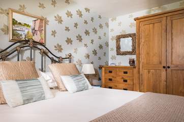 Chunky solid wood furniture and a lovely antique-style bed.