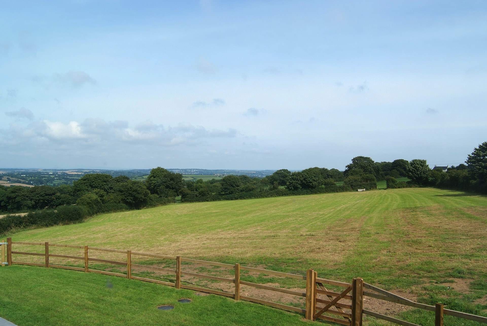 The fabulous view from the first floor bedroom across the field to the countryside and towards Falmouth.