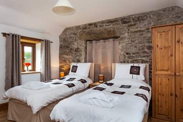 Bedroom 3 has twin beds and is located on the first floor.