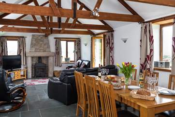 The lovely open plan living space has a wood-burner for those chillier evenings.