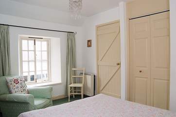 The bedroom is lovely and light.