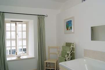 The bathroom is light and spacious.