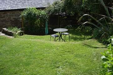 The cottage has a small stone terrace at the front, which captures the morning sun, and a sloping garden to the side of the cottage.