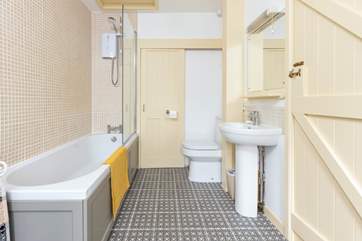 The bathroom is light and spacious.