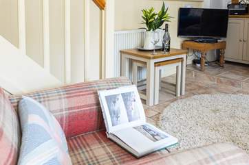 Snuggle up in a blanket and get cosy on the armchair with a glass of something special in hand.
