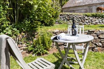 The cottage has a small stone terrace at the front, which captures the morning sun, and a sloping garden to the side of the cottage.