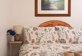 The comfortable bed, perfect for slow mornings.