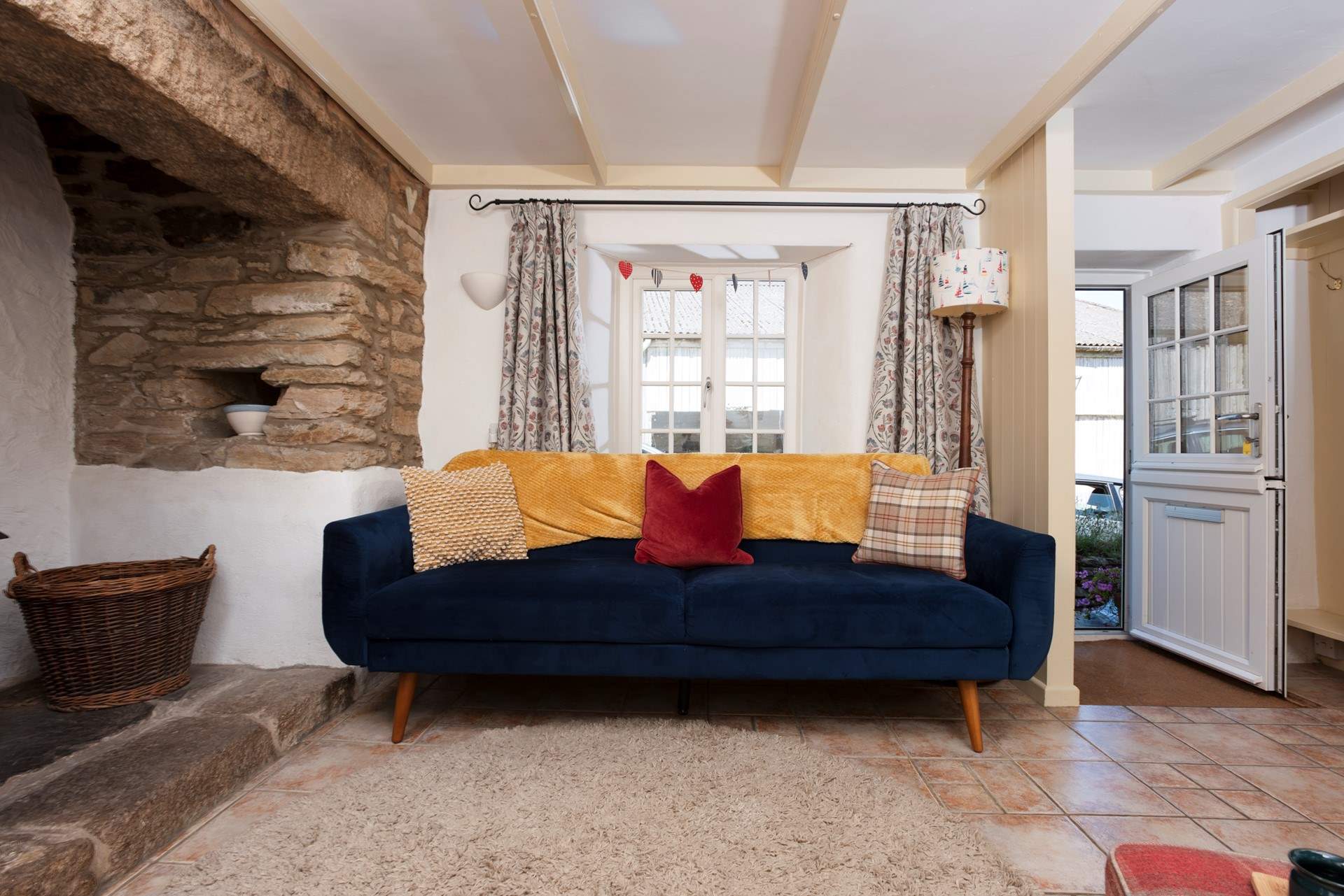 The sitting room boasts a stable door and characterful fireplace.