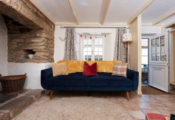 The sitting room boasts a stable door and inglenook fireplace.