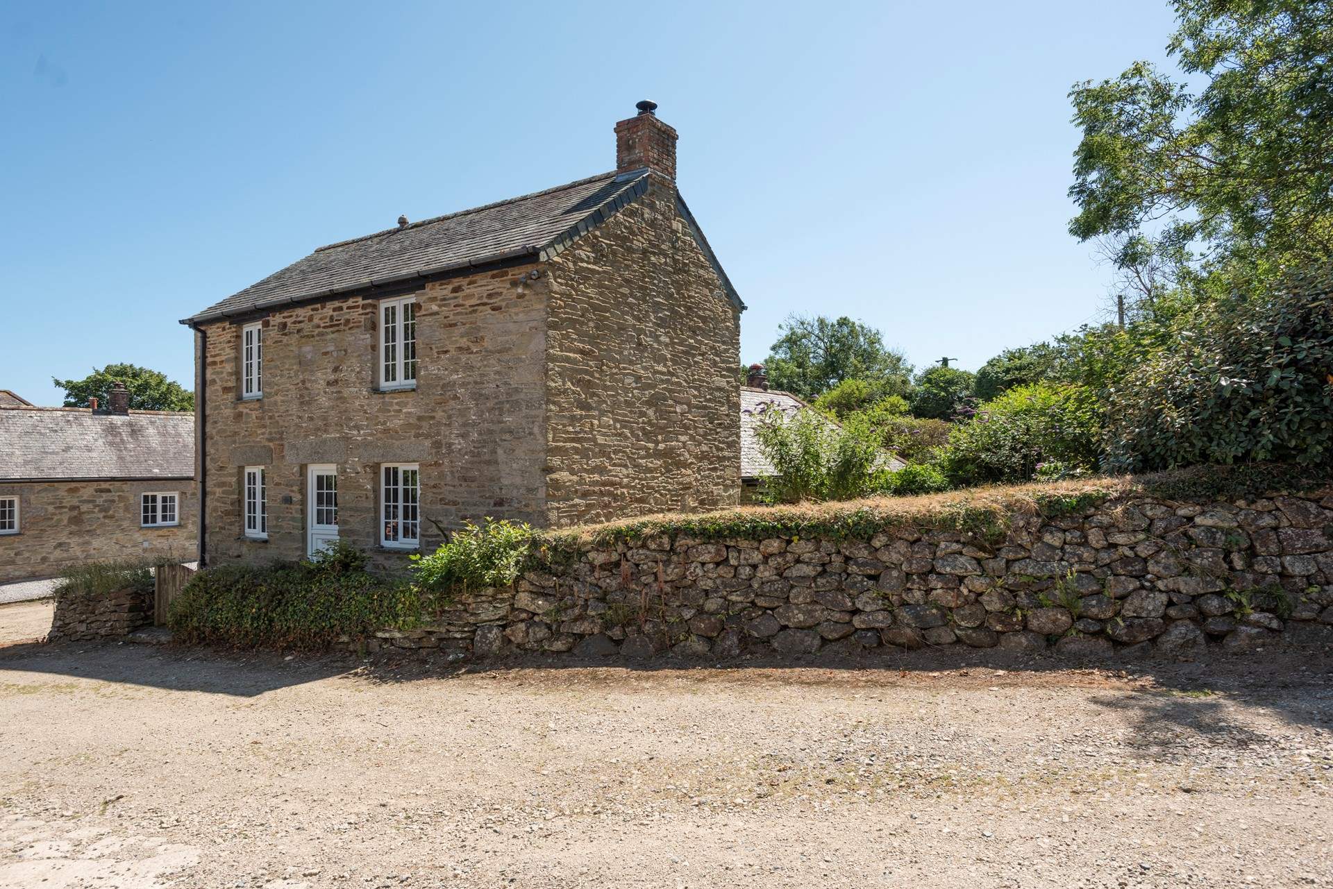 Smugglers Cottage sitting pretty at the end of the private lane.