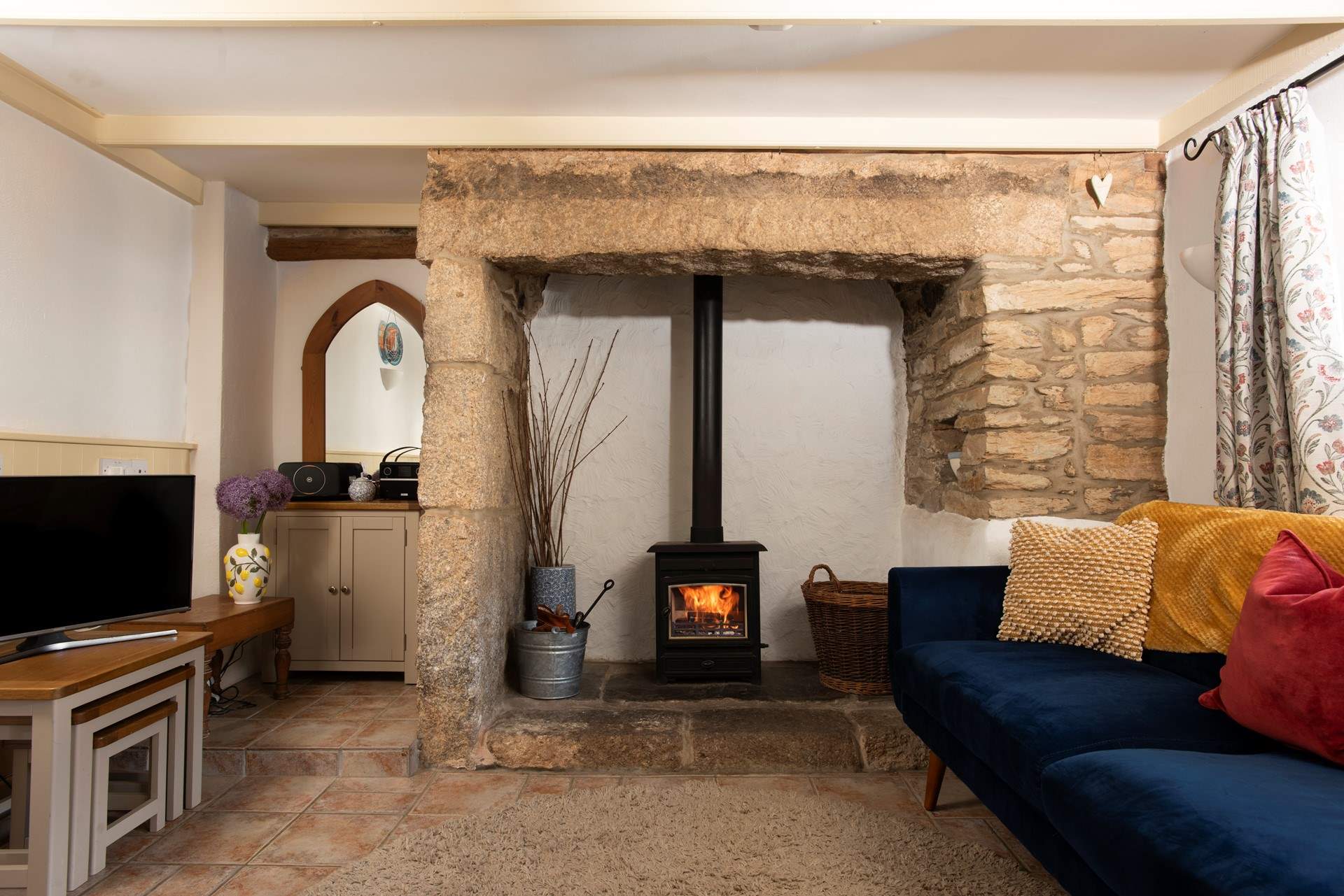 Complete with comfy chairs and a warming wood-burner.