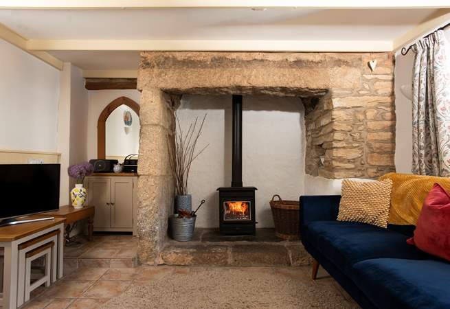 Complete with comfy chairs and a warming wood-burner.