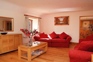 The living-room leads to the dining and kitchen-area.