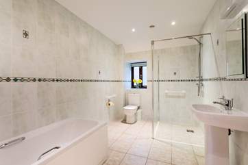 The bathroom with wet-room shower.