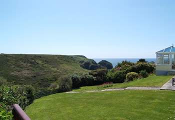 Looking from the end of the patio across the neighbouring garden towards the cove.