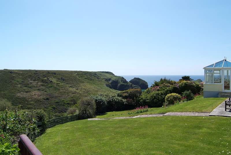 Looking from the end of the patio across the neighbouring garden towards the cove.