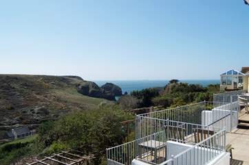 This is the view from the en suite master bedroom window, looking down across the terrace garden towards the harbour and sea beyond.