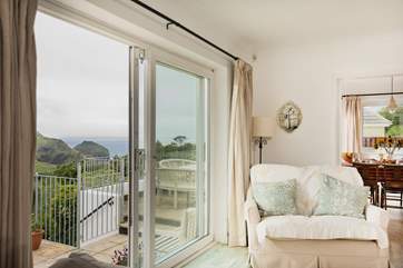 Sliding glass doors open out onto the patio and bring the outside into the house, even on a cloudy day.