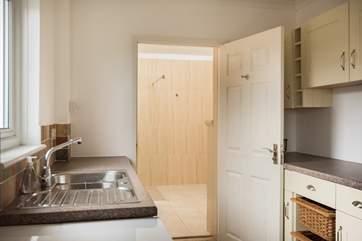 There is a huge wet-room just off the kitchen and through the utility-room.