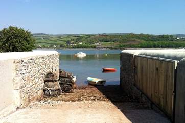 The small lane ends with a slipway down to the pebble beach.