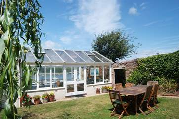 The exterior of the conservatory from the garden.