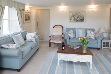 Comfortable sofas in the spacious sitting-room.