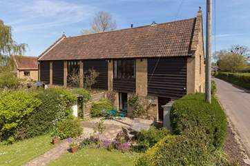 An overall view of Hayloft in its setting within the small group of barn conversions - just three others.