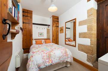 This is the single bedroom. Both bedrooms and bathrooms are on the ground floor.