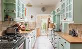 The entrance to the cottage leads up into the lovely country-style kitchen. - Thumbnail Image