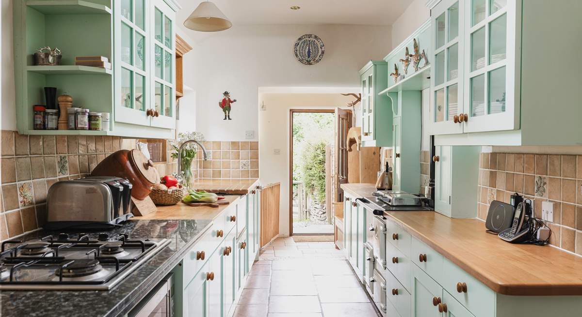 The entrance to the cottage leads up into the lovely country-style kitchen.