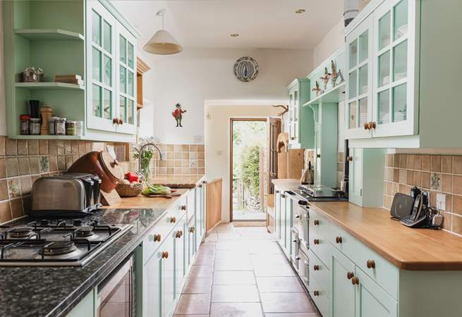 The entrance to the cottage leads up into the lovely country-style kitchen.