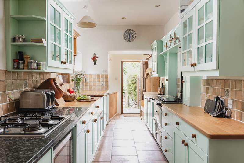 The entrance to the cottage leads up into the lovely country-style kitchen.