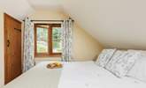 Bedroom 2, the double bedroom, overlooks the secluded garden. - Thumbnail Image