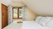 Bedroom 2, the double bedroom, overlooks the secluded garden.