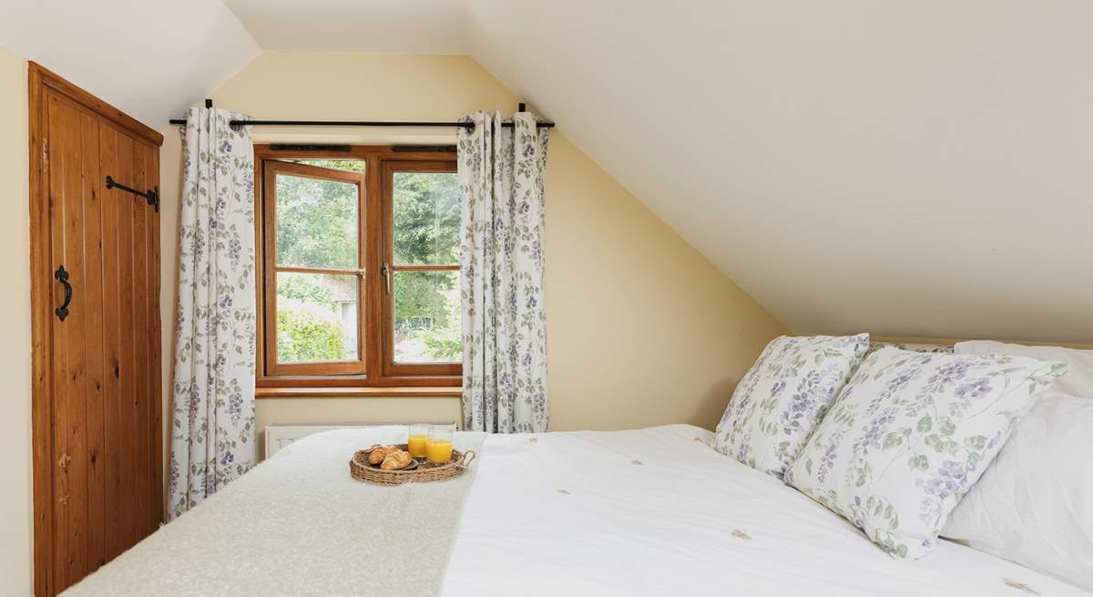 Bedroom 2, the double bedroom, overlooks the secluded garden.