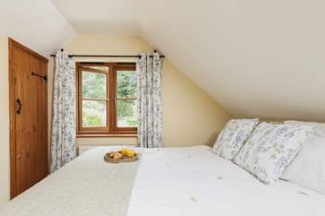 Bedroom 2, the double bedroom, overlooks the secluded garden.