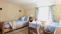 The cosy twin bedroom (Bedroom 3) has dual-aspect windows.