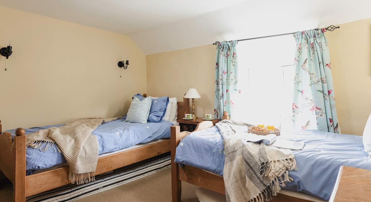 The cosy twin bedroom (Bedroom 3) has dual-aspect windows.