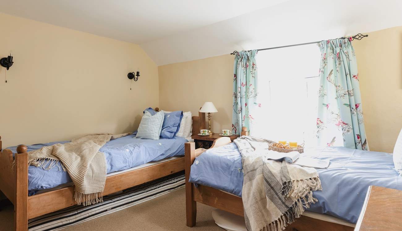 The cosy twin bedroom (Bedroom 3) has dual-aspect windows.