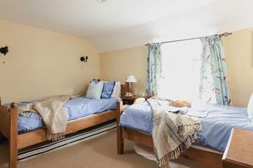 The cosy twin bedroom (Bedroom 3) has dual-aspect windows.